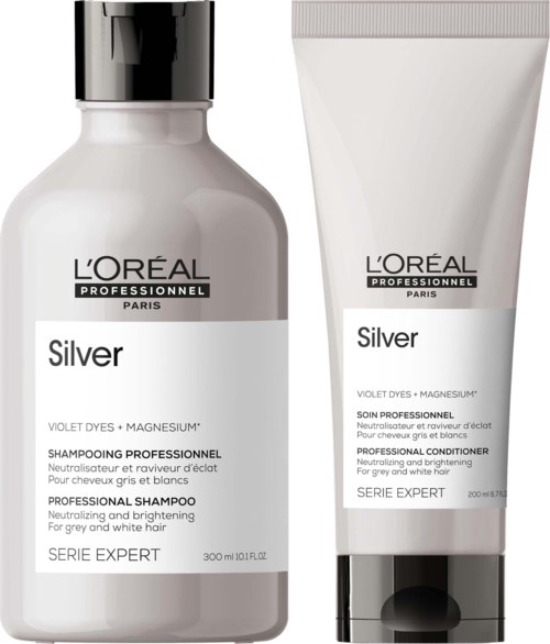Twee haarverzorgingsproducten uit L'Oréal Silver-serie, een shampoo en een conditioner, in witte en zilveren verpakking.