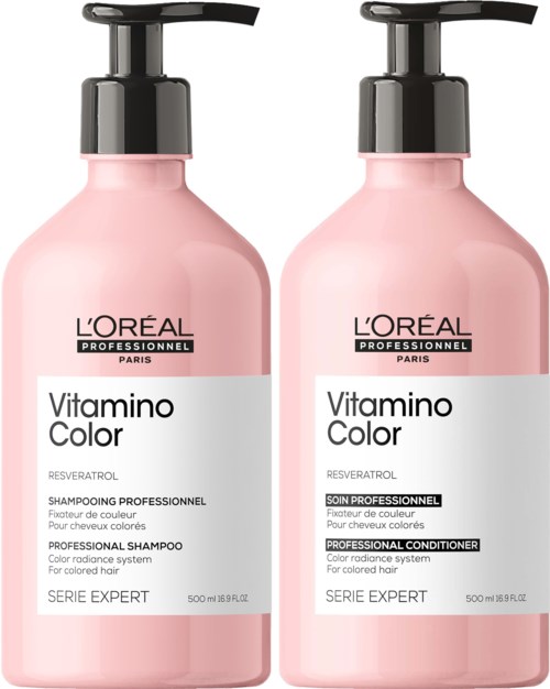 Zwei rosa Flaschen mit L'Oreal-Profi-Haarpflegeprodukten und schwarzen Pumpspendern. Eine ist Shampoo, die andere Conditioner.