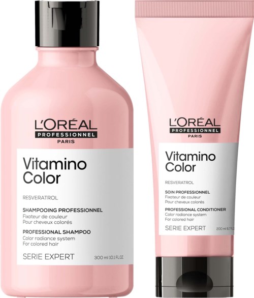 Zwei Haarpflegeprodukte in rosa Verpackungen von L'Oréal, Shampoo und Conditioner für gefärbtes Haar.