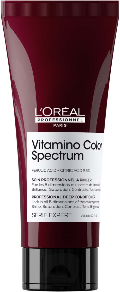 A red tube of L'Oréal Vitamino Color Spectrum professional deep conditioner with a black cap.