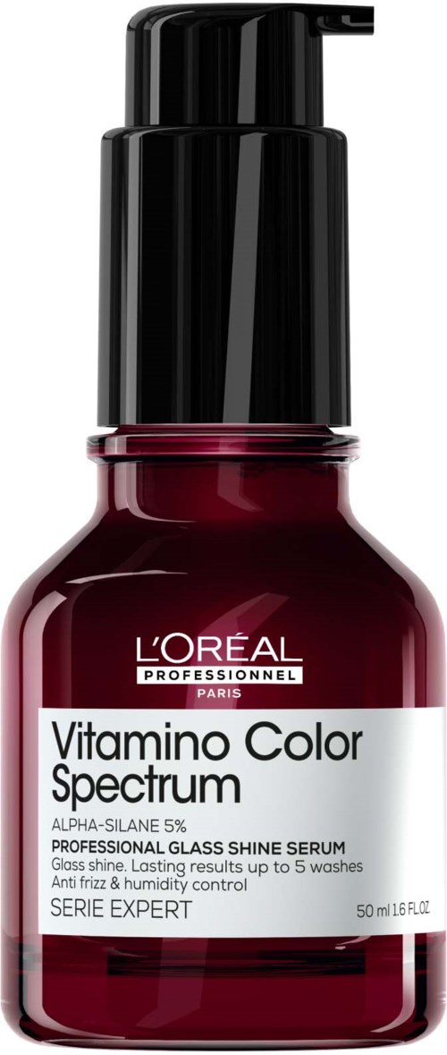 A small bottle with a pump labeled L'Oreal Vitamin C serum, dark red liquid inside.