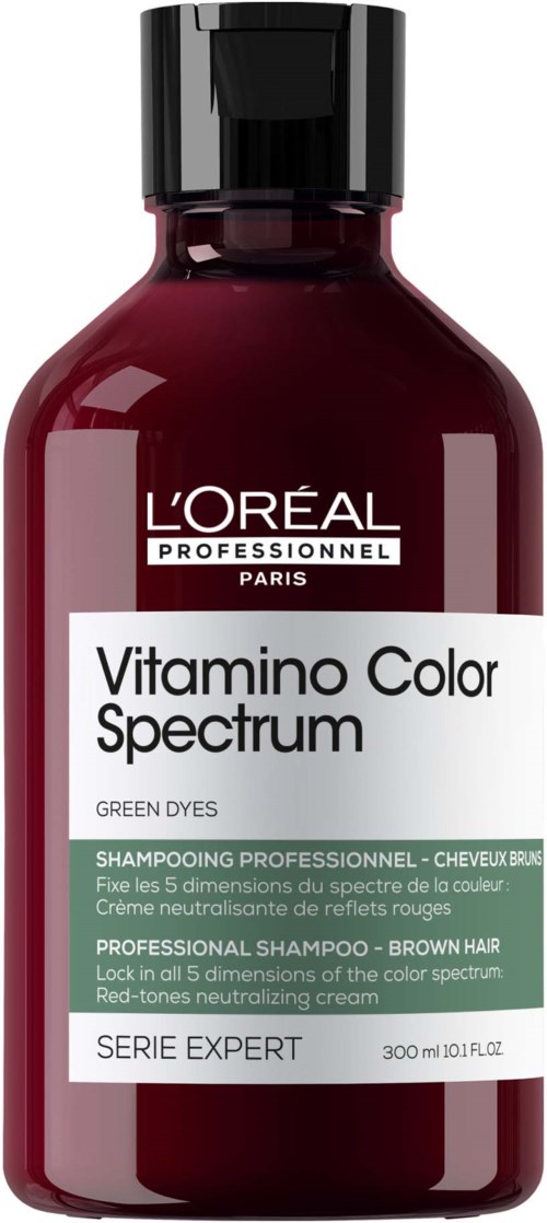 A dark red bottle of L'Oréal hair dye shampoo with a black cap, labeled for professional use on brown hair.