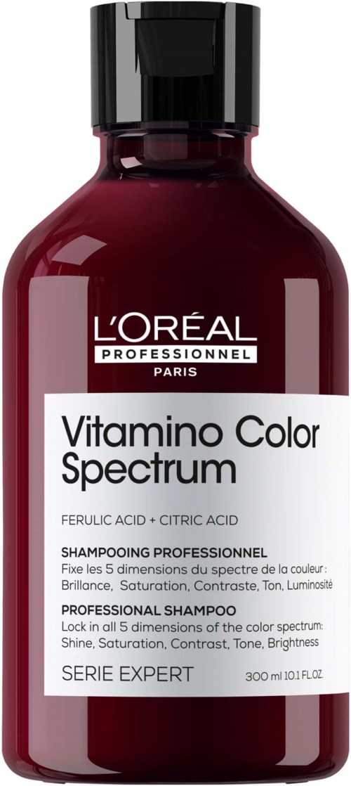 Viininpunainen pullo mustalla kannella, L'Oréal-logo ja valkoinen etiketti ammattilaisen väriskaalamshampoossa.