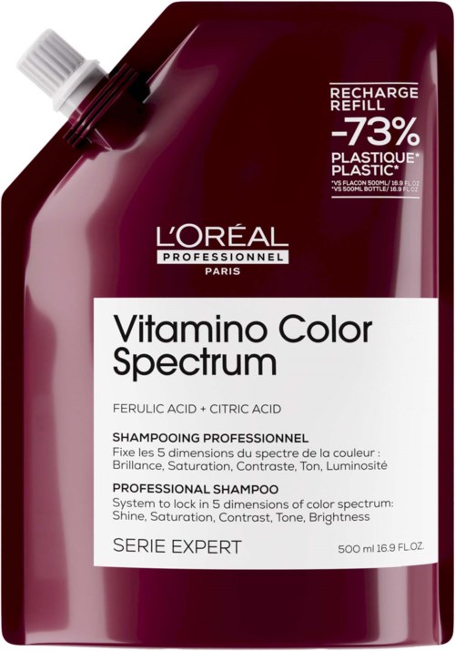 A maroon-colored bottle of L'Oréal Professionnel shampoo with a white label, indicating 'Vitamino Color Spectrum' and 'Professional Shampoo' for color care.