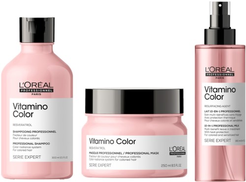 Drei rosa Haarpflegeprodukte von L'Oréal, Shampoo, Maske und Spray, für das Färben der Haare.