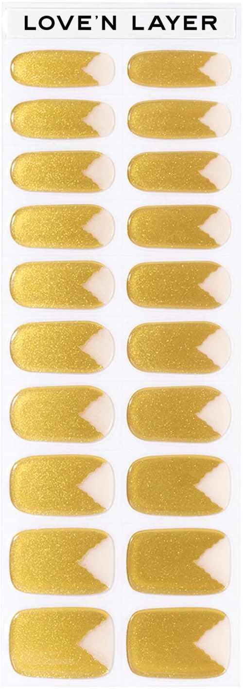 Golden and white accent nail tips on a strip labeled 'LOVE'N LAYER.'