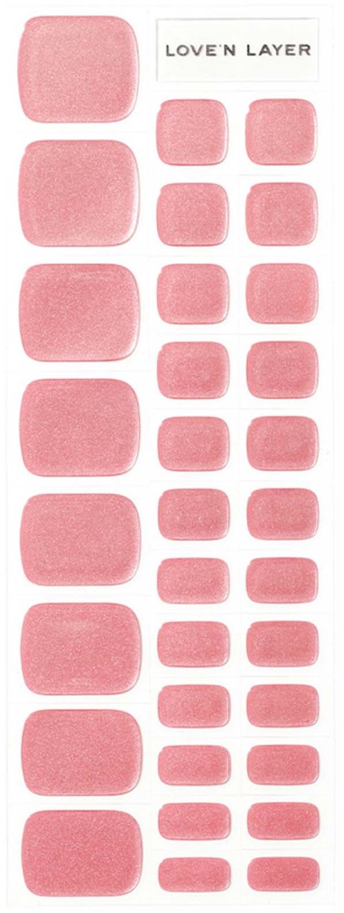 Rosa fyrkantiga och rektangulära nagellacksborttagare med etiketts "LOVE 'N' LAYER".