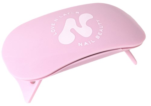 Pink nail care device with a white logo that says "Love Nail Beauty" and an 'N' symbol.