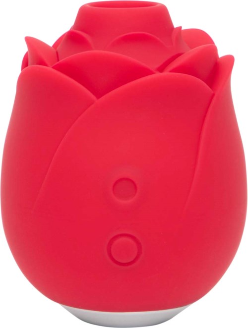 A red, rose-shaped object, looks like a decorative item or a toy, with a smooth texture and rounded form.