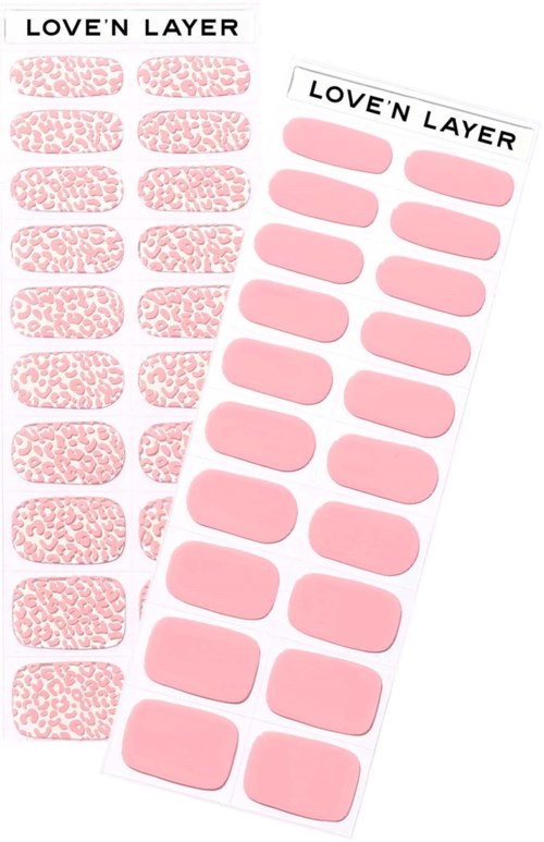 Two sheets of pink nail extension stickers, one with textured design, the other plain, labeled 'LOVE'N LAYER'.