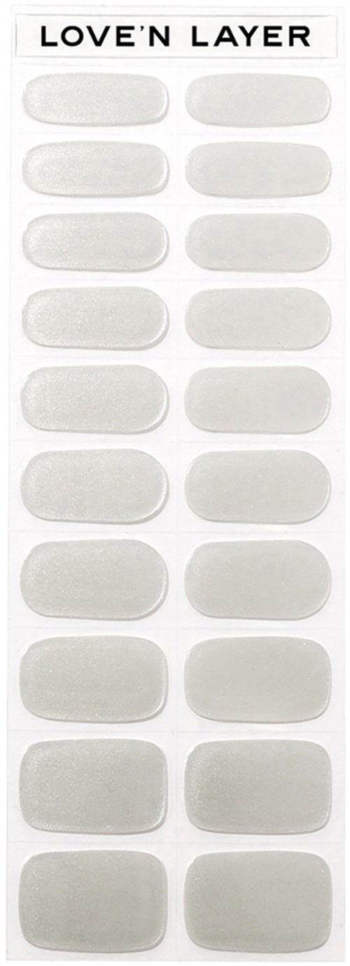 A sheet of white stickers labeled "LOVE'N LAYER" with blank oval spaces for decoration.
