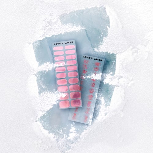 Two sheets of pink nail stickers on a snowy surface, labeled "Loven Layer."