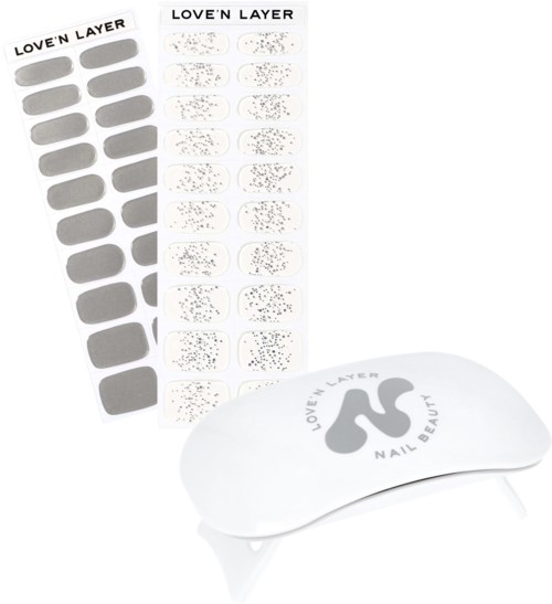 Nail stickers and a white pad with the Love'n Layer logo for nail art decoration.