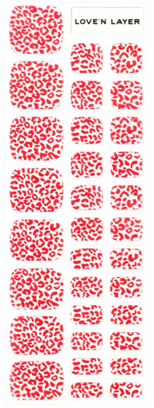 A sticker sheet features various red leopard print designs. The patterns are different in size and shape, with a small label saying "LOVE'N LAYER."