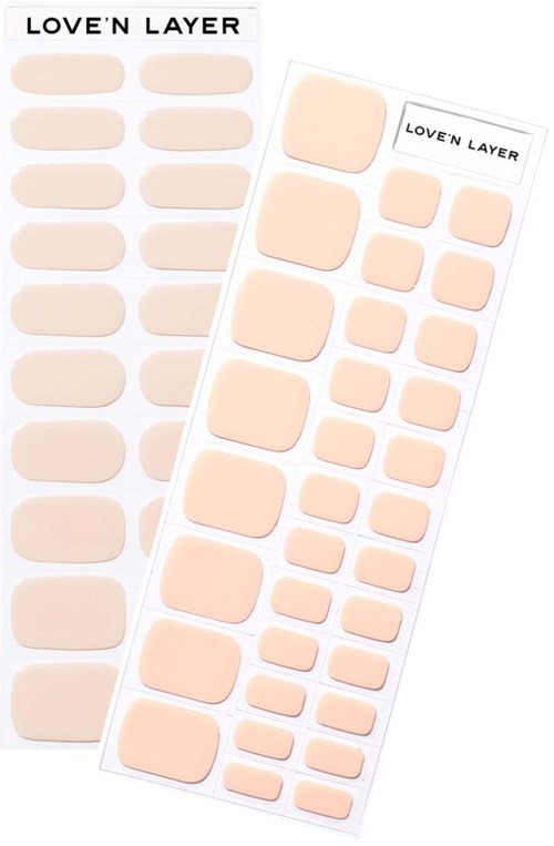 Two sheets of beige, oval and square-shaped adhesive patches labeled 'LOVE'N LAYER'.