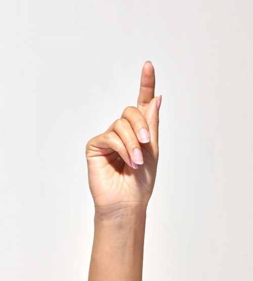 A hand with the index finger pointing up, against a plain background.