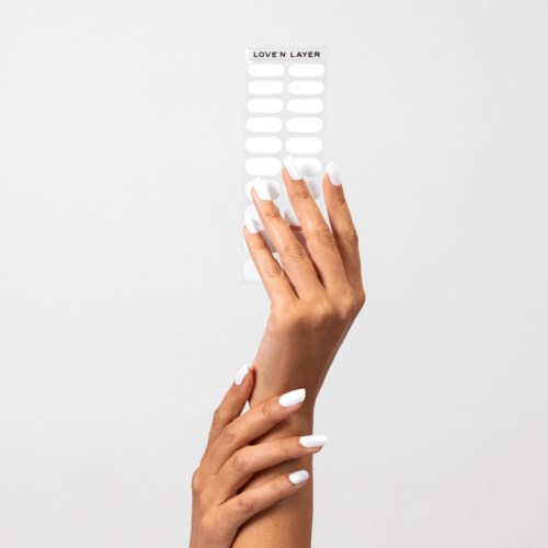 A hand with white nails touches a label that says "Lover Layer" with blank lines below.