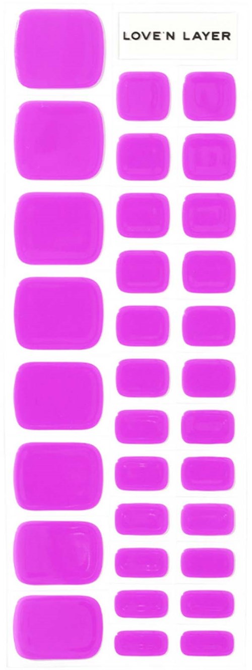 A collection of different sizes of purple gel-like makeup or skincare patches arranged in rows. There is a label that says "LOVE'N LAYER."