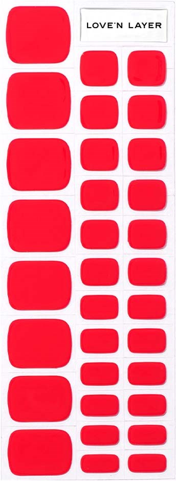 A white sheet with various red sticker shapes and the words "LOVE'N LAYER" at the top.
