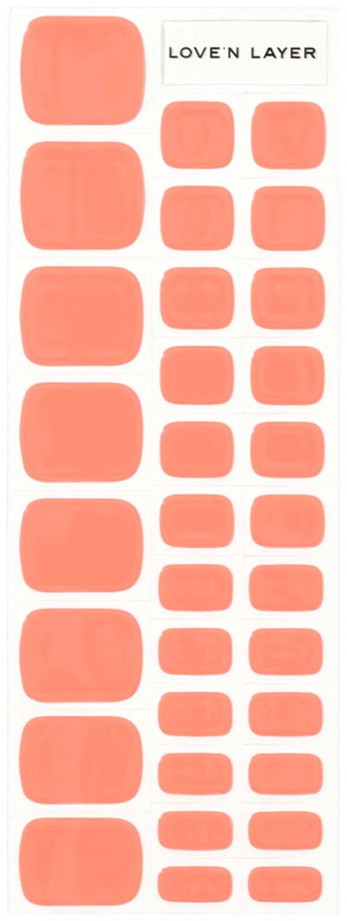 A sticker sheet with various sizes of peach-colored stickers, labeled 'LOVE N LAYER' at the top.