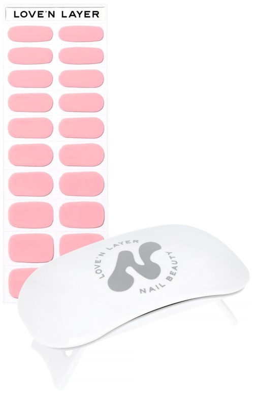 Nail stickers with pink 'love'n layer' design and a white nail tool with the same branding.