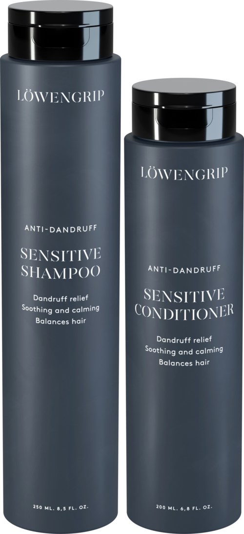 Zwei dunkelgraue Flaschen mit Shampoo und Conditioner für empfindliche Kopfhaut, mit schwarzen Deckeln und weißem Text.