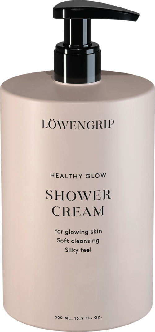 En vit flaska med svart pump, märkt Löwengrip Healthy Glow Shower Cream, för mjuk och glänsande hud.