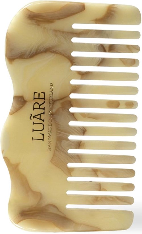 Eine beige-braune marmorierte Haarbürste mit dem Wort 'LUARE', gebaut mit breiten Zähnen für das Styling.