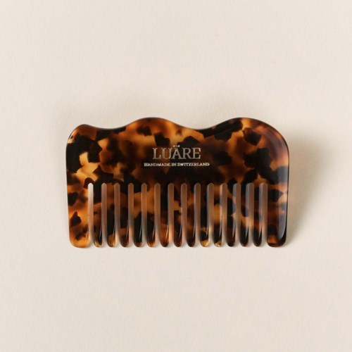 Ein Haarbürste im Tortoiseshell-Design mit dem Namen 'LUARE'.