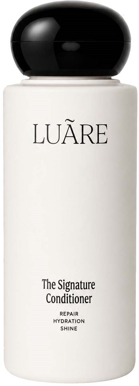 En vit flaska med svart lock med Luare The Signature Conditioner, märkt för reparation, hydrering och glans.