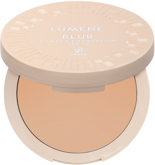 A compact powder container with a beige lid and powder inside, labeled 'Lumene Blur Powder Foundation'.