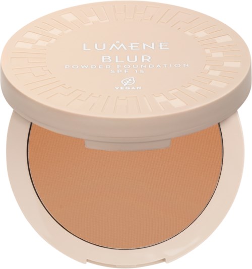 Ett runt förpackning av Lumene Blur pudergrund alltid med lös lock som visar beige puder inuti.