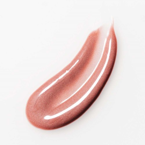 Ein Klecks glänzender hellbrauner Make-up- oder Lipgloss auf weißem Hintergrund.
