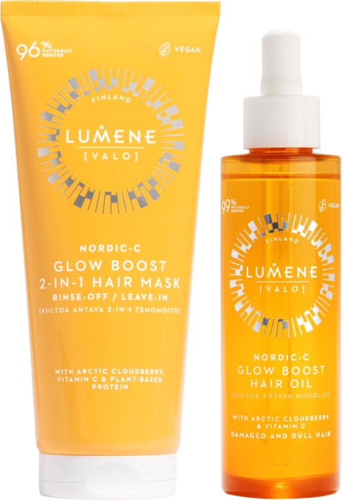 Een gele tube haarmasker en een oranje fles haarolie, beide met LUMENE-labels en Nordic-C Glow Boost branding.