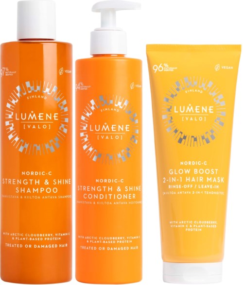 Drie oranje haarverzorgingsproducten van Lumene Valo: shampoo, conditioner en haarmasker.