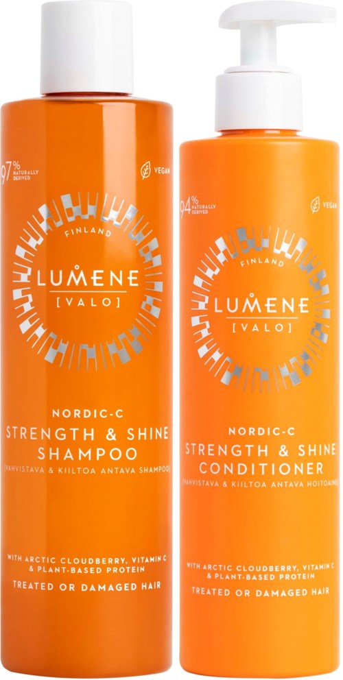 Twee oranje flessen haarverzorgingsproducten, een voor shampoo en een voor conditioner, met witte doppen en labels.