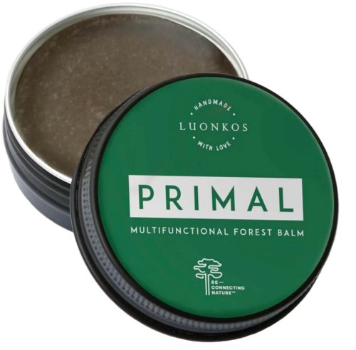 Runde Dose mit grünem Deckel, beschriftet mit 'PRIMAL' und 'Multifunktionale Waldbalsam.'
