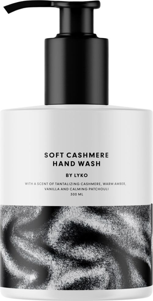 En vit flaska med svart pump som innehåller mjuk cashmeres handtvätt med vaniljsmak och lugnande patchouli.