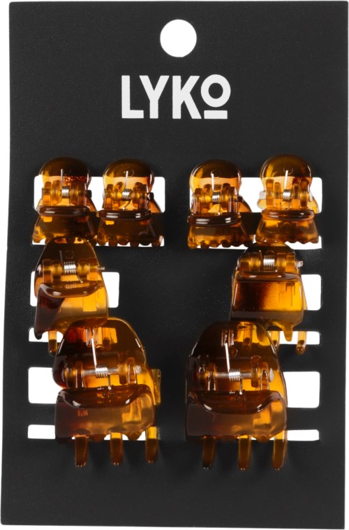 Four pairs of amber hair clips on black card with white logo and holes for hanging.