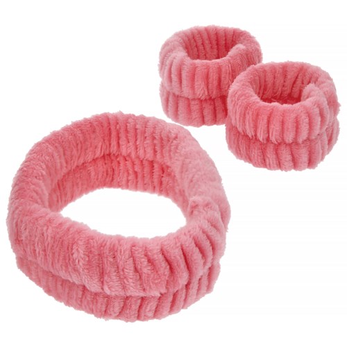 A set of three pink, fluffy, ribbed hairbands of different sizes stacked together. They are soft and cozy.