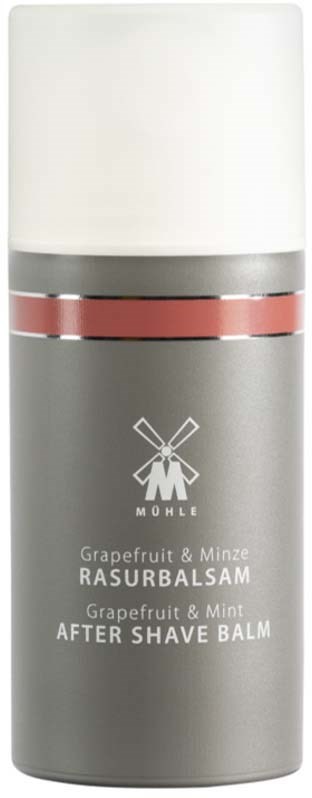 A tall, gray spray bottle with a white cap and pink band, labeled as after shave balm with grapefruit and mint.