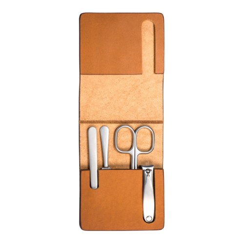 A travel manicure set with tools like clippers, scissors, and nail file inside a brown case.