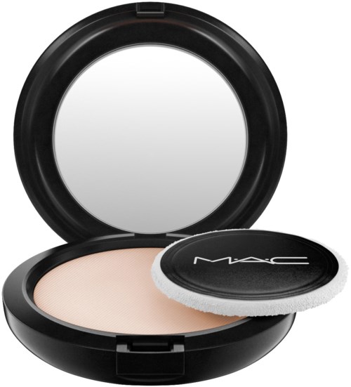 A compact with a mirror, beige powder, and a round applicator pad, all inside a black case.