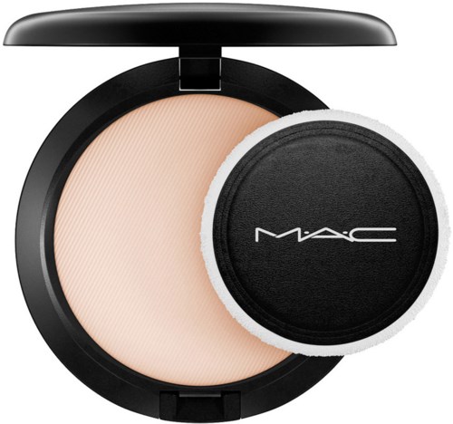 A compact makeup powder case with a puff, branded MAC, open to show light-colored powder inside.