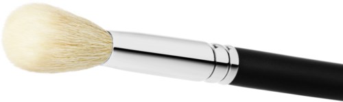 A makeup brush with a white fluffy tip and black handle on a black background.