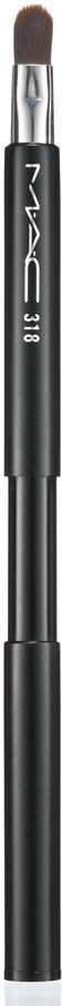 A black makeup brush with a rounded tip and a silver ferrule, with white text on the handle.