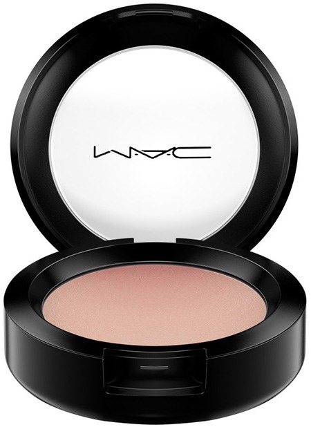 A round makeup compact with the MAC logo, containing pinkish-beige powder inside.