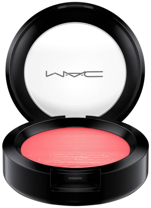 A round black makeup case open to show pink blush inside with MAC logo inside the lid.