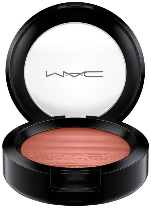 A round black container with blush makeup inside and a white label with black 'MAC' text.