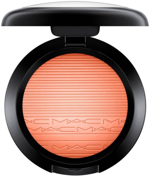A round makeup blush with a black case and the MAC logo engraved, in peach color with horizontal lines.